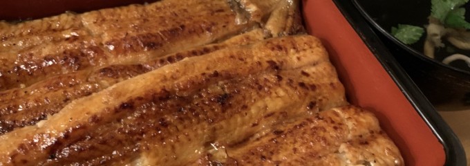 うな明